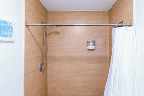 Hair dryer, towels, shampoo, toilet paper