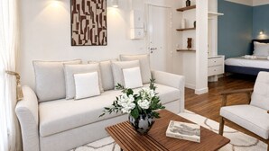 Premium Studio, Courtyard View | Living area | 80-cm Smart TV with digital channels