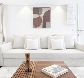 Premium Studio, Courtyard View | Living area | 80-cm Smart TV with digital channels