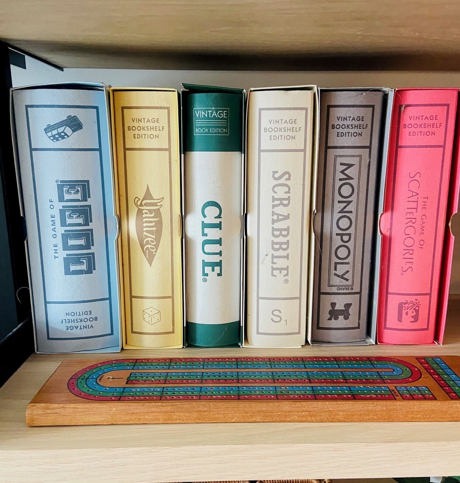 A bookshelf with vintage board games.