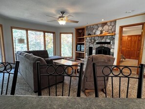 TV, fireplace, table football - A Spacious Lake House with Private Dock (Orr)