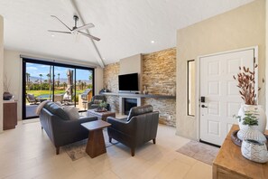 Smart TV, fireplace, books, stereo