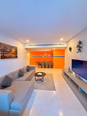 Family Triple Room, Balcony, City View | Living area