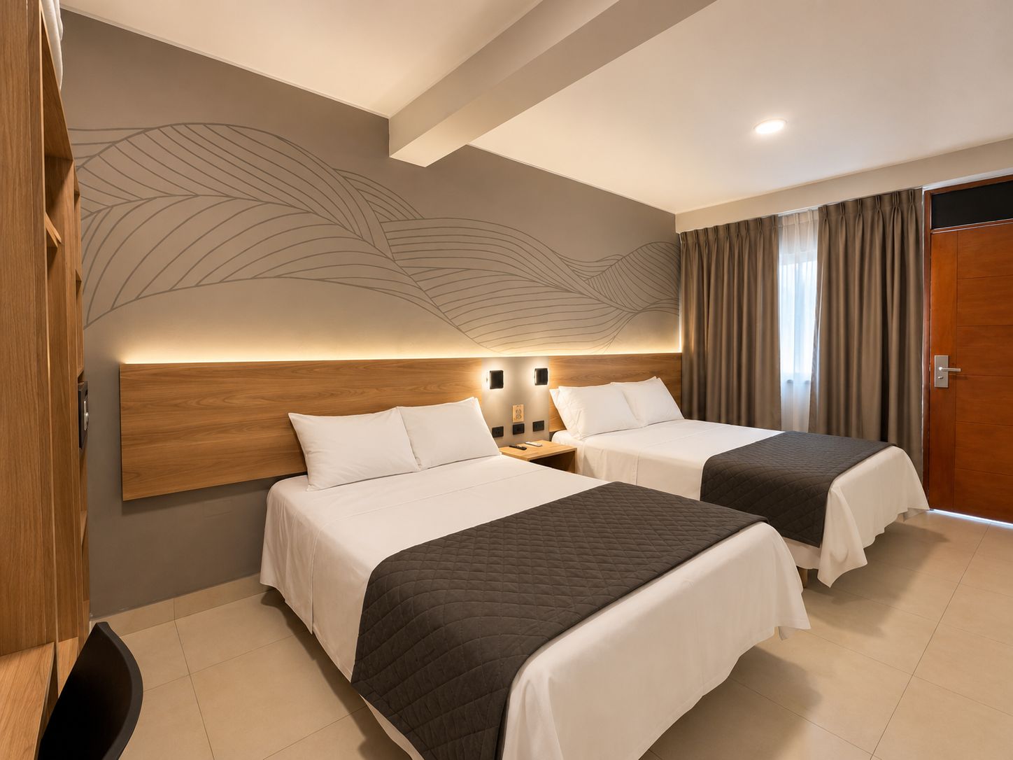 A hotel room with two beds, a wooden headboard, a wall mural, and a window with curtains.