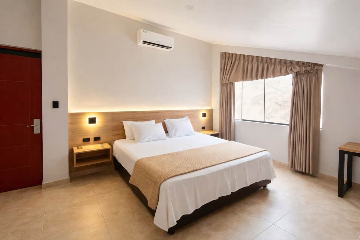 Deluxe Double Room | In-room safe, desk, laptop workspace, blackout drapes