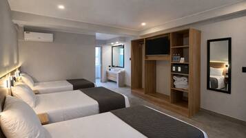 Deluxe Triple Room, Balcony, City View | In-room safe, desk, laptop workspace, blackout curtains