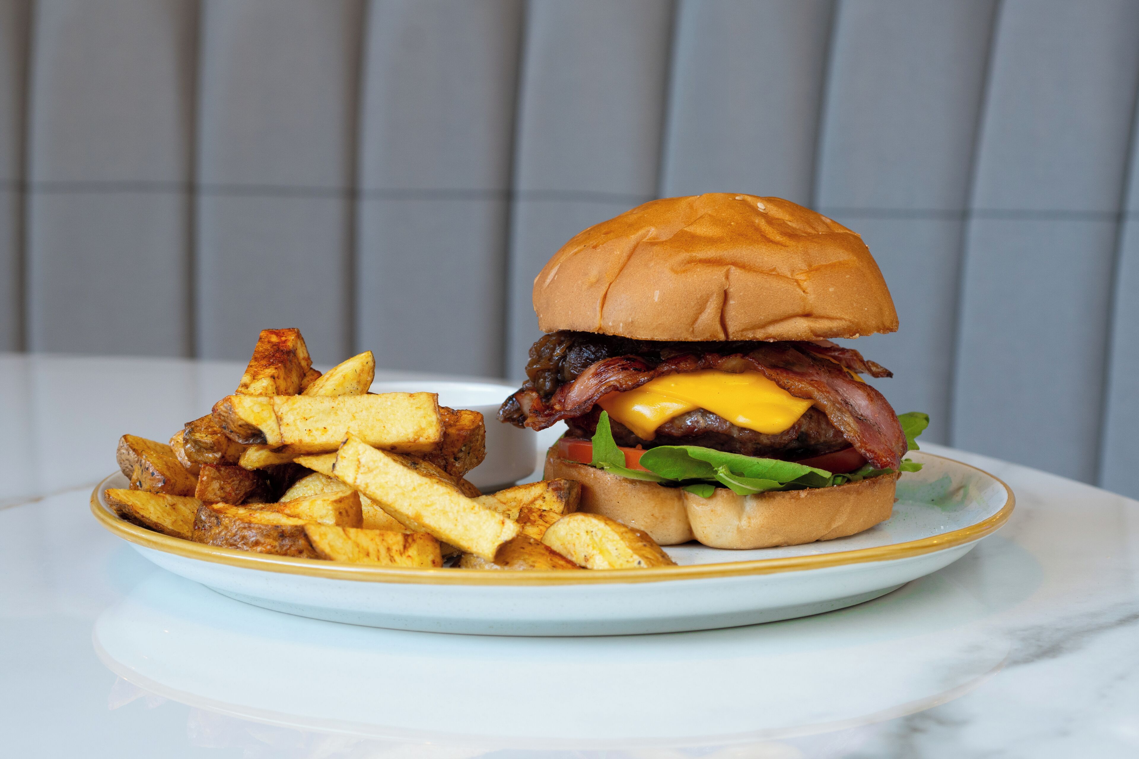 A plate with a burger and fries.