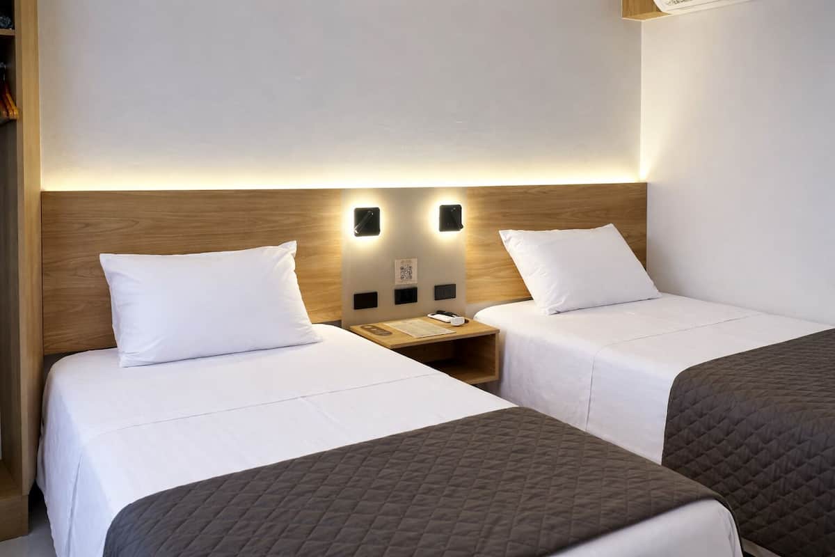 Basic Twin Room | In-room safe, desk, laptop workspace, blackout drapes