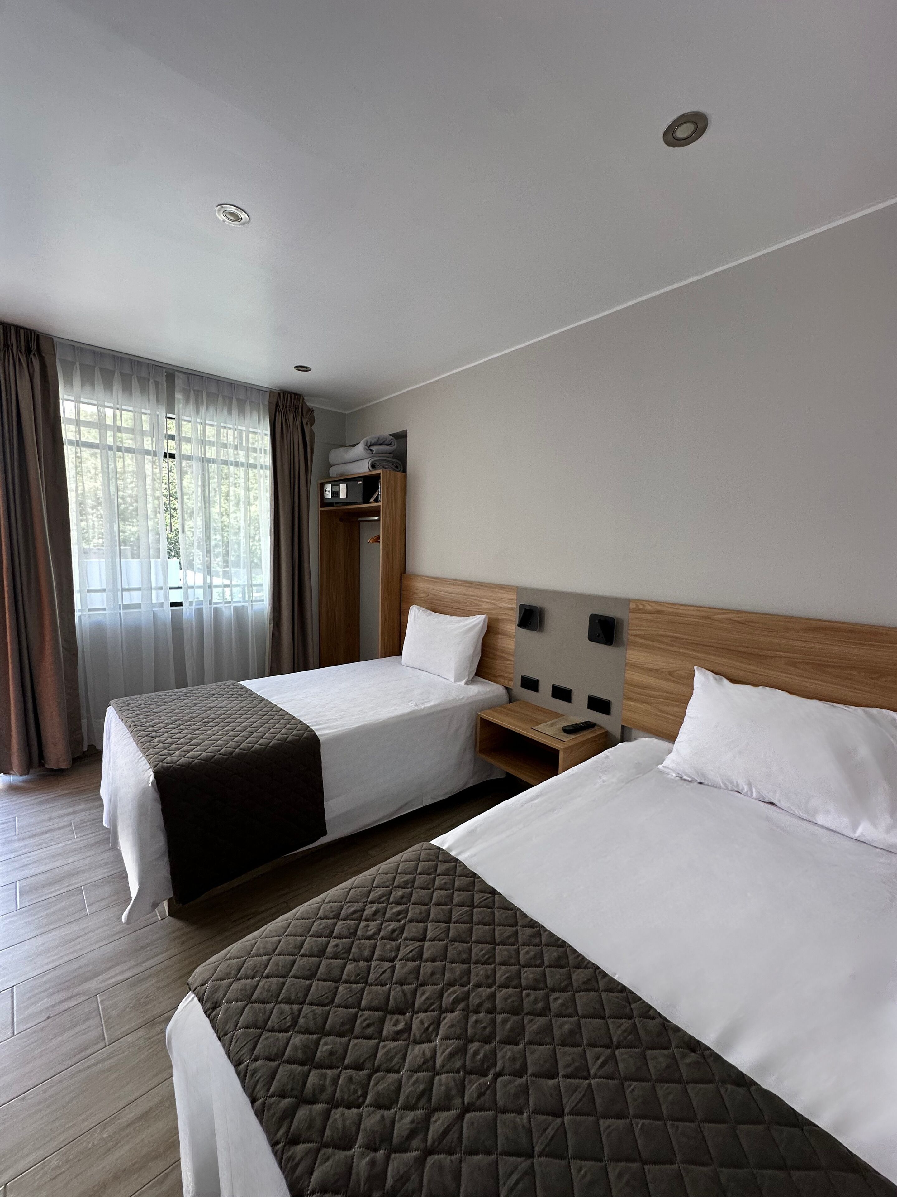 Basic Twin Room | In-room safe, desk, laptop workspace, blackout drapes