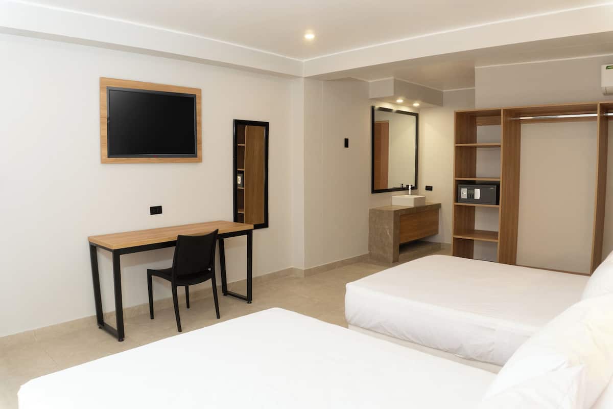 Deluxe Double Room, Balcony, City View | In-room safe, desk, laptop workspace, blackout drapes
