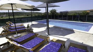 House (Five Bedroom Holiday Home) | Outdoor pool | Outdoor pool, pool umbrellas, sun loungers