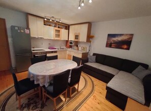 Apartment (Two Bedroom Apartment with Terrace no) | Living room | 32-inch flat-screen TV with cable channels - Apartments Ivan Supetar (Supetar)
