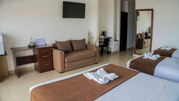 Family Quadruple Room, Balcony, Ocean View | Living area | TV