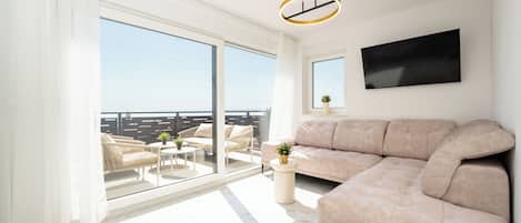 Comfort Apartment, 2 Bedrooms, Sea View | Living area | 50-cm TV with satellite channels