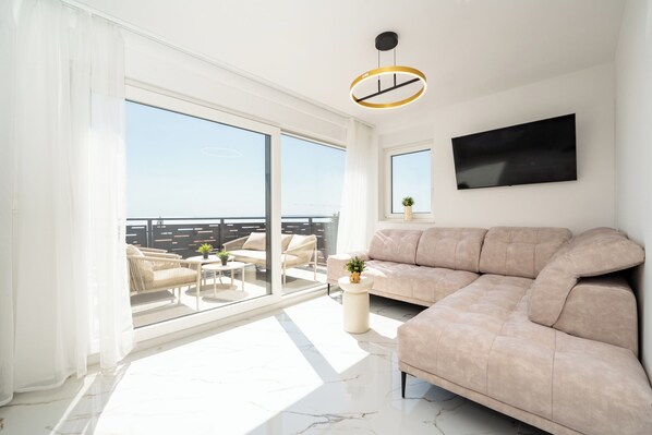 Comfort Apartment, 2 Bedrooms, Sea View | Living area | 50-cm TV with satellite channels