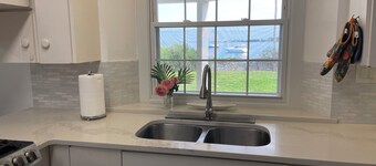 Spacious 4-bedroom beachfront estate in tranquil Somerset Village with AC, WiFi