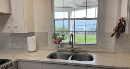 Spacious 4-bedroom beachfront estate in tranquil Somerset Village with AC, WiFi