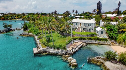 Spacious 4-bedroom beachfront estate in tranquil Somerset Village with AC, WiFi