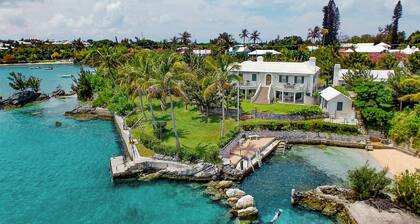 Spacious 4-bedroom beachfront estate in tranquil Somerset Village with AC, WiFi