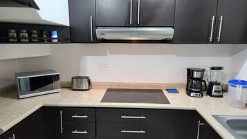 Fridge, microwave, stovetop, coffee/tea maker