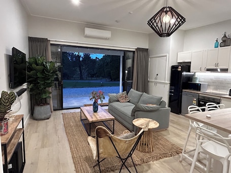 Living area. EcoShed - Private Riverfront Getaway. Eco-friendly, pet friendly, close to town