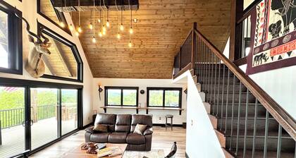 A unique modern farmhouse nestled on 67 rolling acres w/stunning views.