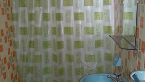 A bathroom with a toilet, bidet, and sink, all in a matching blue color. - Hotel San Francisco (Santa Teresita)