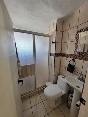 Shower, towels, soap, toilet paper