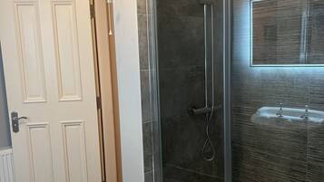 Shower, towels, toilet paper