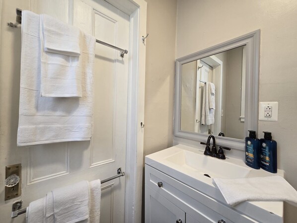 Hair dryer, towels, soap, toilet paper