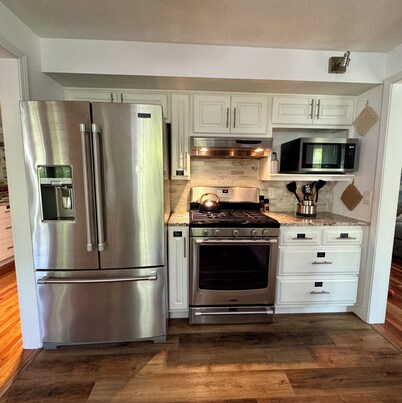 The Big Blue House – Spacious Bryan Retreat w/Game Room & Dog-Friendly Yard