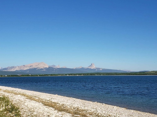 Glacier National Park views from this private nearby Duck lake waterfront home.