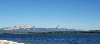 Glacier National Park views from this private nearby Duck lake waterfront home.