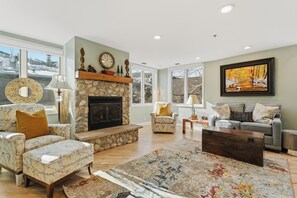 Smart TV, fireplace, books, offices