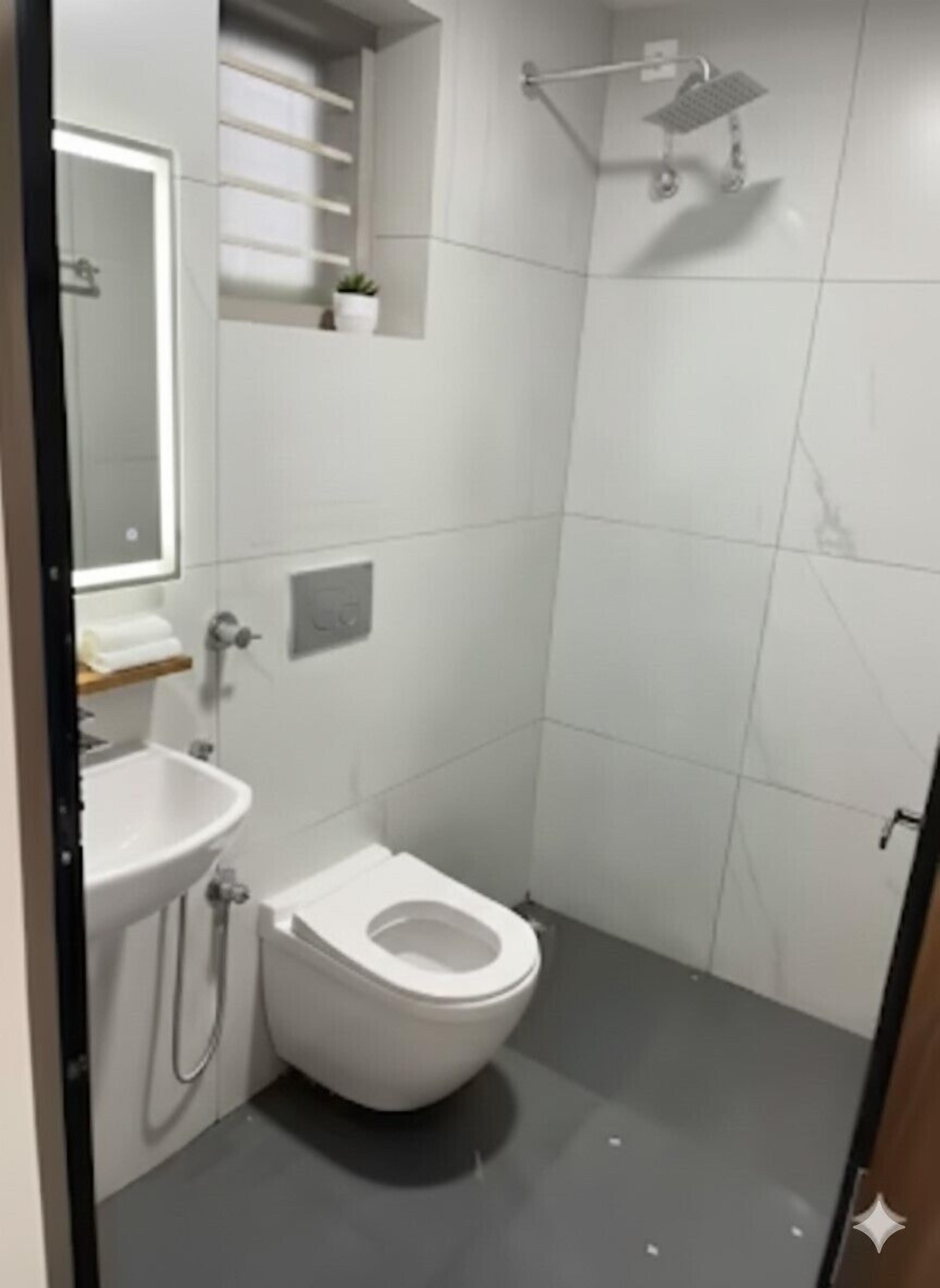 Shower, towels, soap, toilet paper