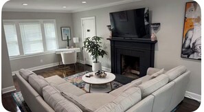 Smart TV, fireplace, books, stereo