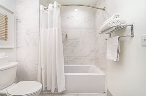 Shower, hair dryer, towels, shampoo