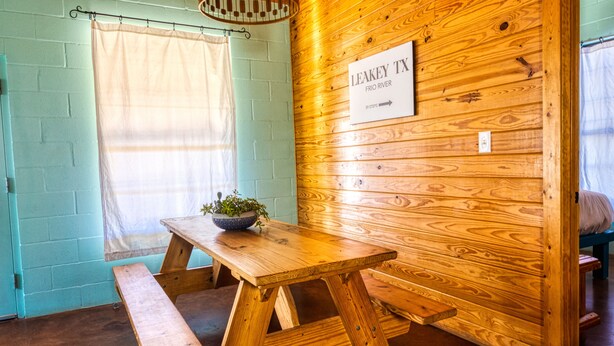 A wooden interior with a sign reading "Leakey TX FRIO RIVER 39 STEPS". - Crystal Clear Frio River - Private Waterfront House - Room for the Family (Concan)