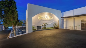 The exterior of a modern building with a sign reading "Casa de Lani Resort & Convention." - Casa De Lani Resort & Convention (Baturaden)