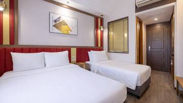 Deluxe Triple Room, Non Smoking, City View | Premium bedding, pillowtop beds, in-room safe, desk