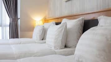 Deluxe Triple Room, Non Smoking, City View | Premium bedding, pillowtop beds, in-room safe, desk