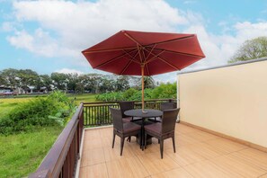 Deluxe Villa, Pool View | Balcony view