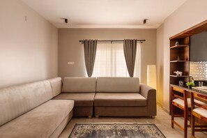 Apartment (2 Bedrooms) | Living area | TV