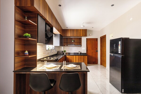 Apartment (2 Bedrooms) | Private kitchen | Microwave, high chair, blender, cookware/dishes/utensils - Aurum Heights by Red Olive (Bengaluru)