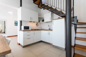 Classic Apartment | Private kitchenette | Fridge, stovetop, high chair, cookware/dishes/utensils