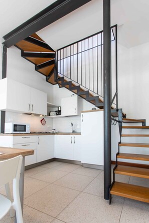 Classic Apartment | Private kitchenette | Fridge, stovetop, highchair, cookware/dishes/utensils