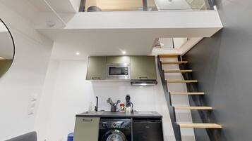 Fridge, microwave, coffee/tea maker, cookware/dishes/utensils