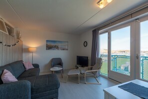 Apartamento luxo, 1 quarto | Sala de estar