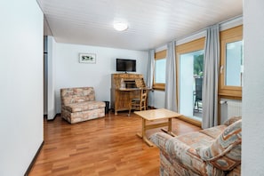 Suíte júnior, sacada, vista para o jardim | Área de estar