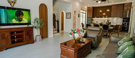 Superior Villa, Garden View | Living area | 45-cm flat-screen TV with satellite channels